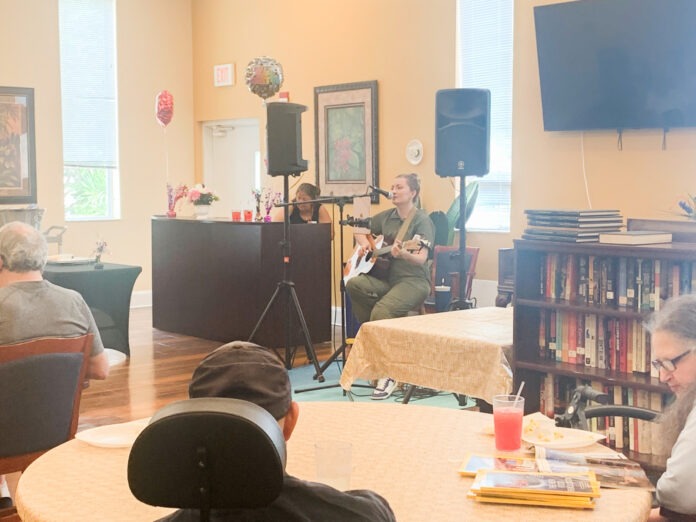 a group of people sitting around a table