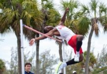 a man is doing a high jump on a pole