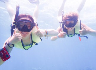 a couple of people that are in the water