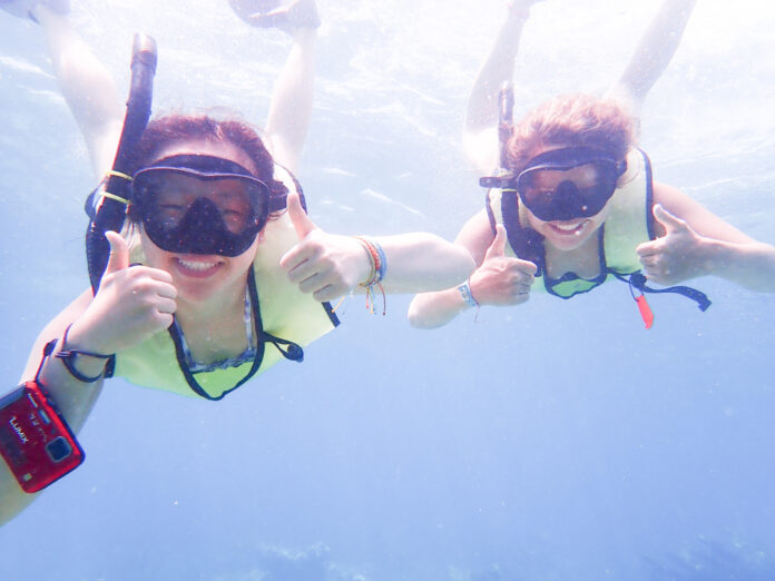 a couple of people that are in the water
