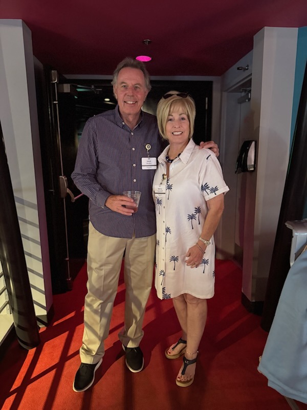 a man and a woman standing in a hallway