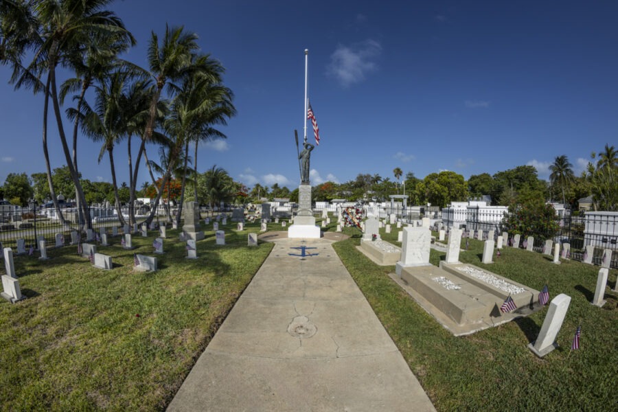 a cemetery with a flag on top of it