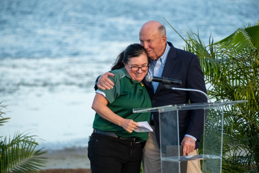 a man and a woman standing at a podium