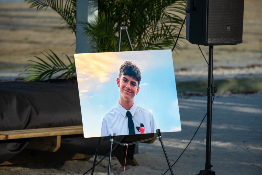 a portrait of a young man is placed in front of a speaker