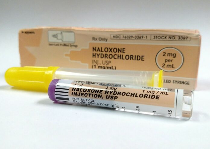 Naloxone_2_(cropped) a tube of naloxone hydrochloride next to a box of