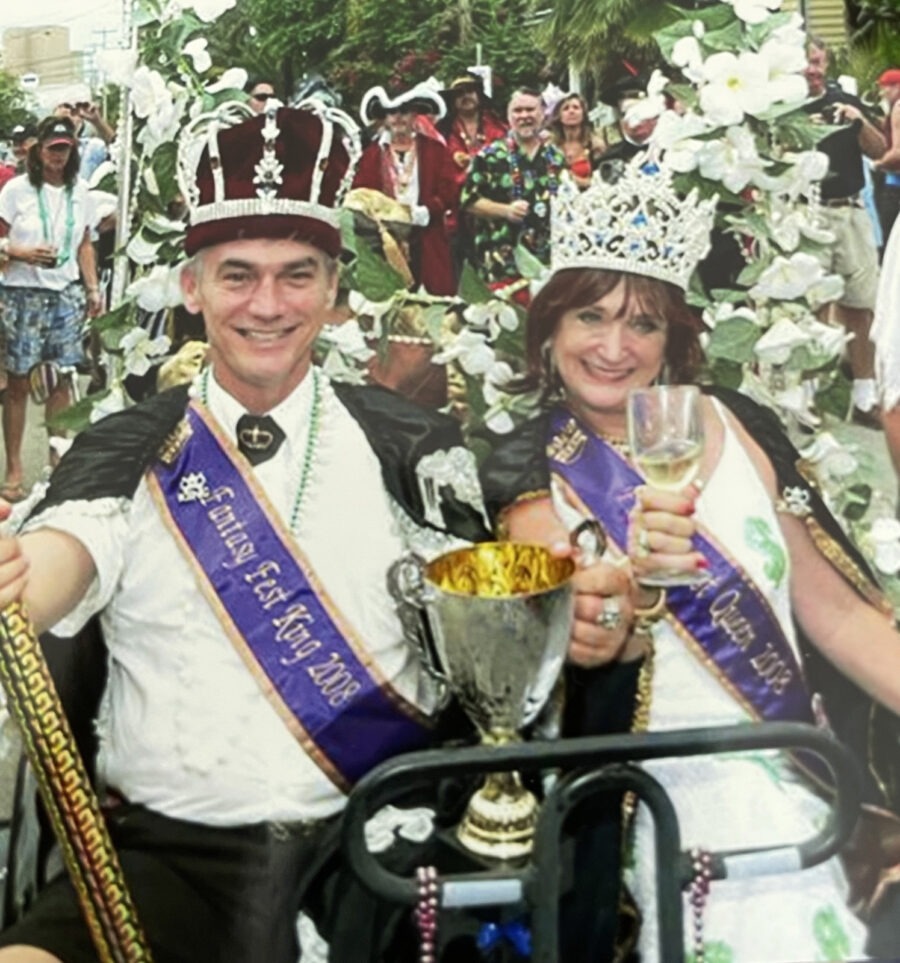 a couple of people that are holding a trophy