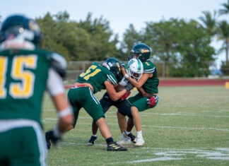 a group of young men playing a game of football