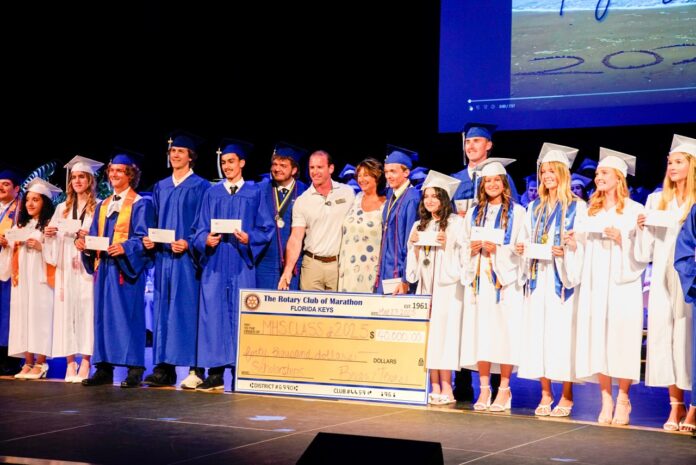 a group of people standing on top of a stage