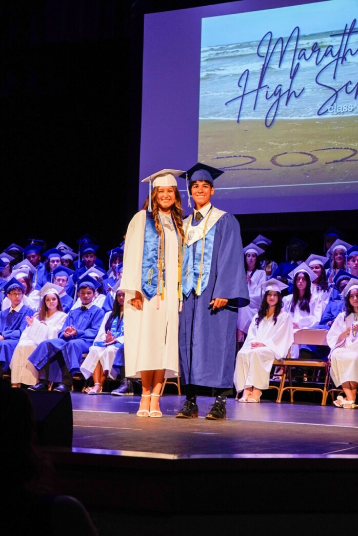 a couple of people that are standing on a stage
