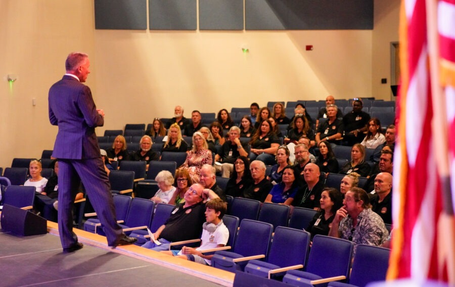 a man standing in front of a crowd of people