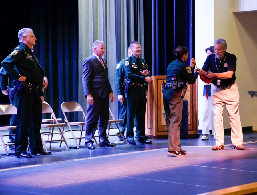 a group of men standing on top of a stage