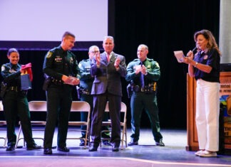 a group of people that are standing in front of a podium