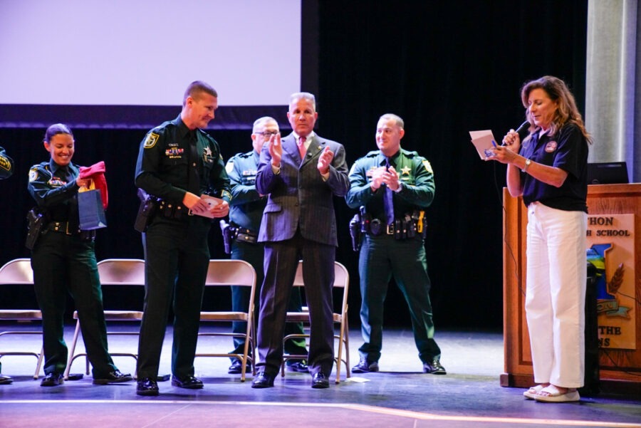 a group of people that are standing in front of a podium