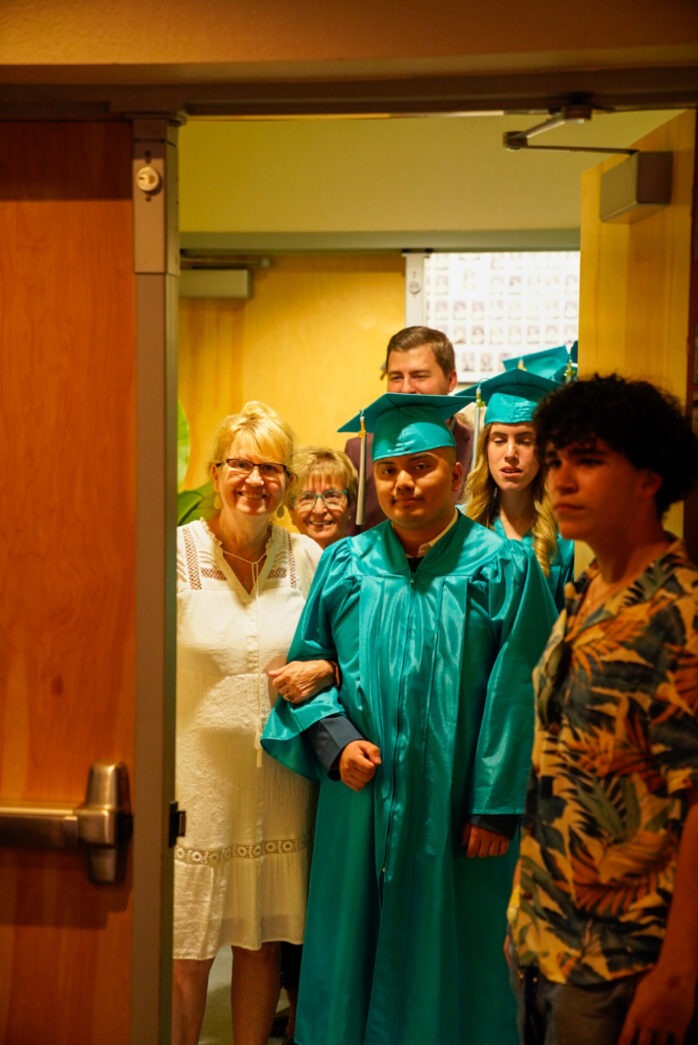 a group of people standing in front of a door