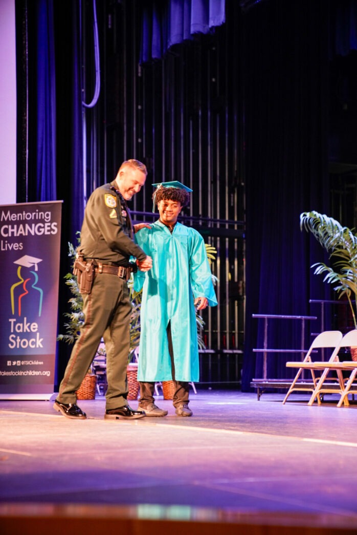 a couple of people that are standing on a stage