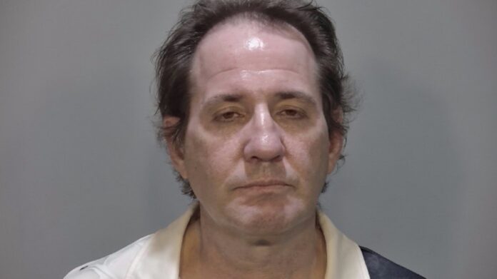 Rollins Warden mugshot Large a mug shot of a man in a white shirt