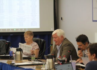 a group of people sitting around a table