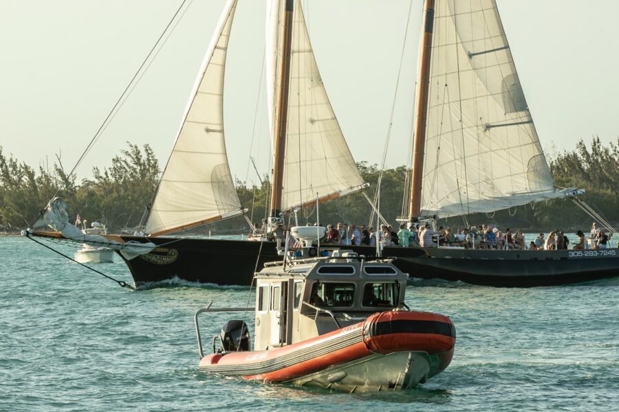 a group of boats floating on top of a body of water