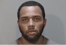 a mug shot of a man with a beard
