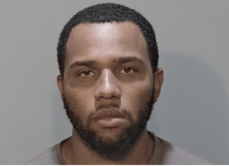 a mug shot of a man with a beard