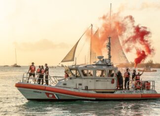 a group of people on a boat in the water