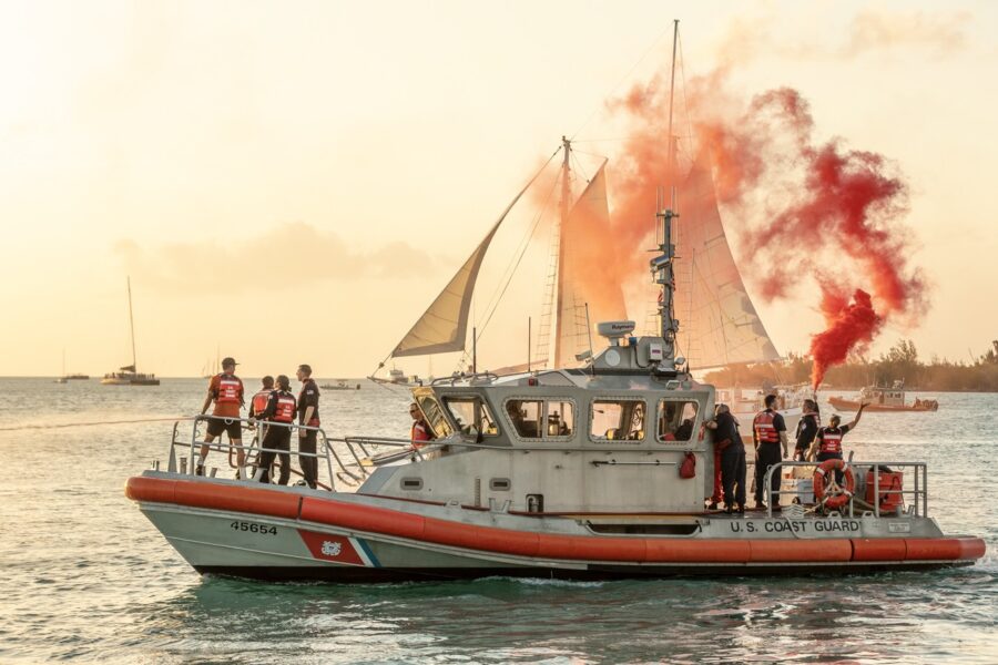 a group of people on a boat in the water