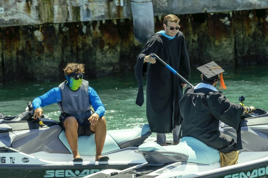 a group of people riding on the back of a boat