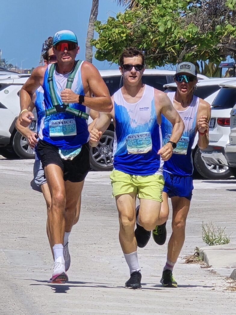 a group of men running in a marathon