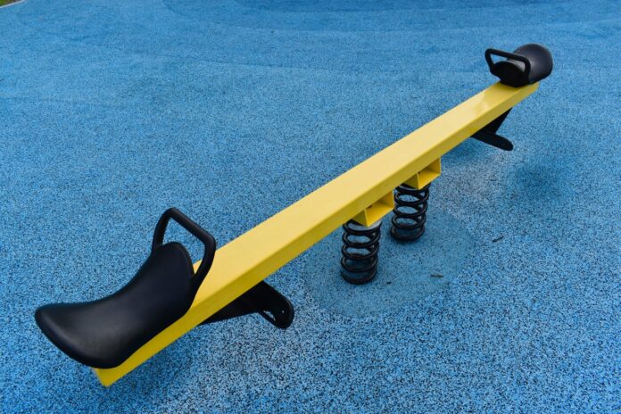 a yellow and black bench on a blue carpet