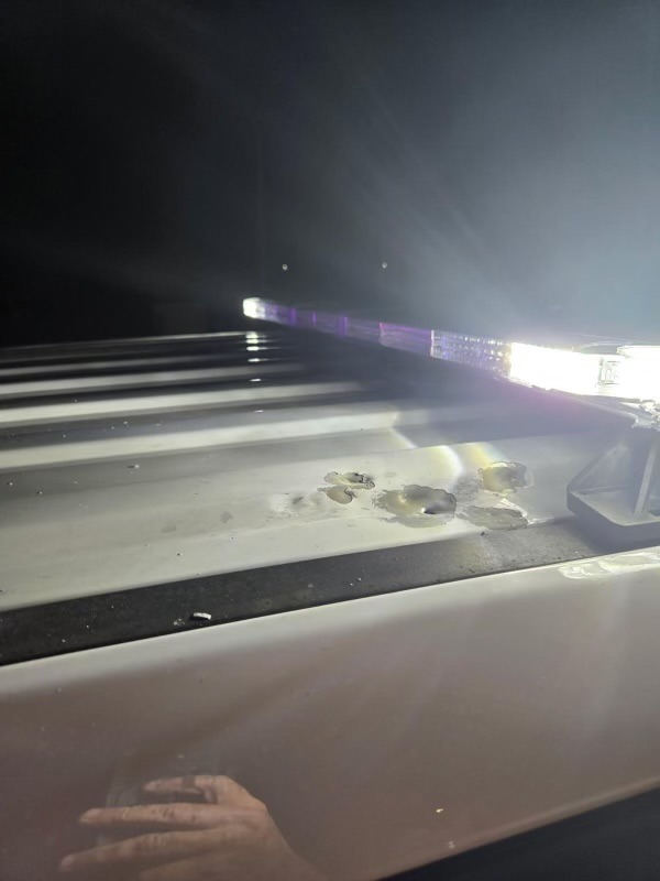 a police car with its lights on at night
