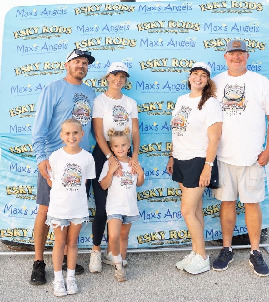 a group of people standing in front of a sign