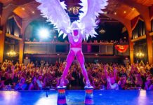 a person on a stage with angel wings