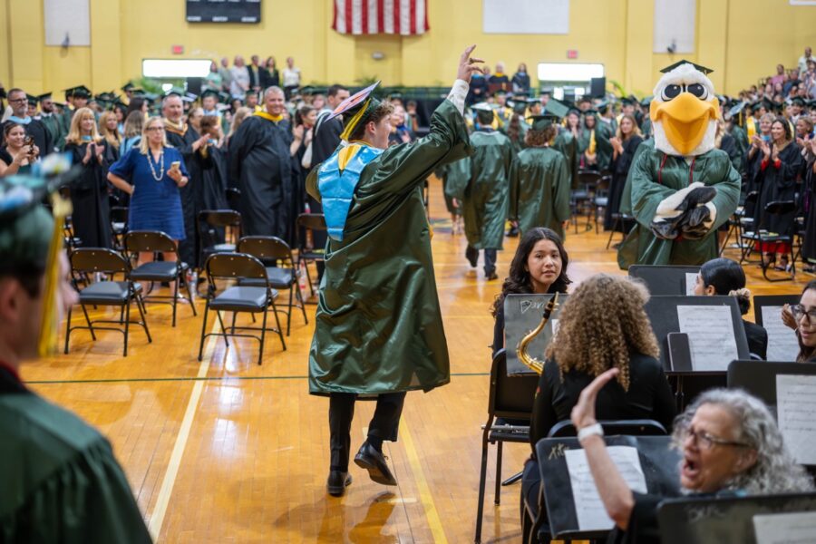 a large group of people in graduation gowns