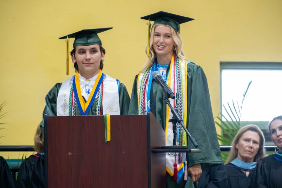 a group of people that are standing in front of a podium