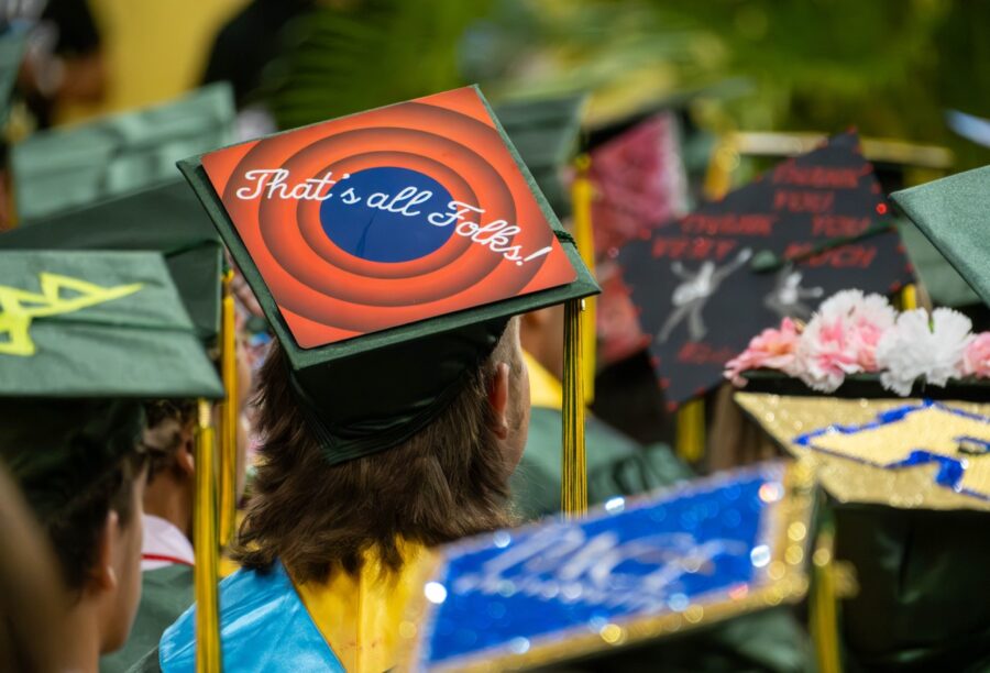 a group of people in graduation caps and gowns