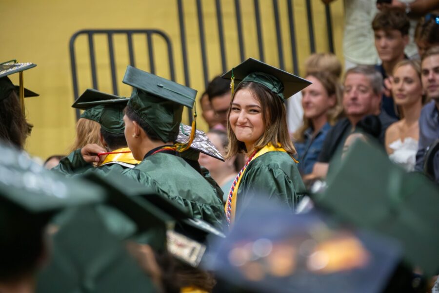 a group of people in graduation caps and gowns