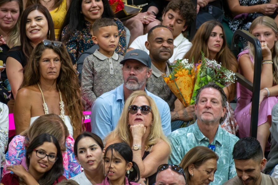 a crowd of people sitting next to each other