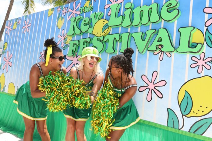 1 Key Lime Fest_Carol Tedesco_5Q0A9501 Large a group of women standing next to each other in front of a wall