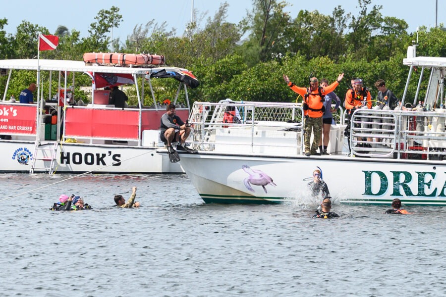 a group of people on a boat in the water