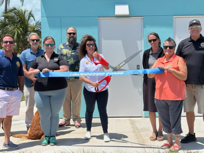 a group of people holding a large blue ribbon