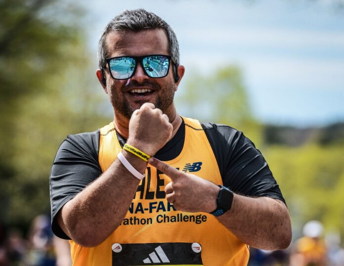 a man in a yellow shirt and sunglasses