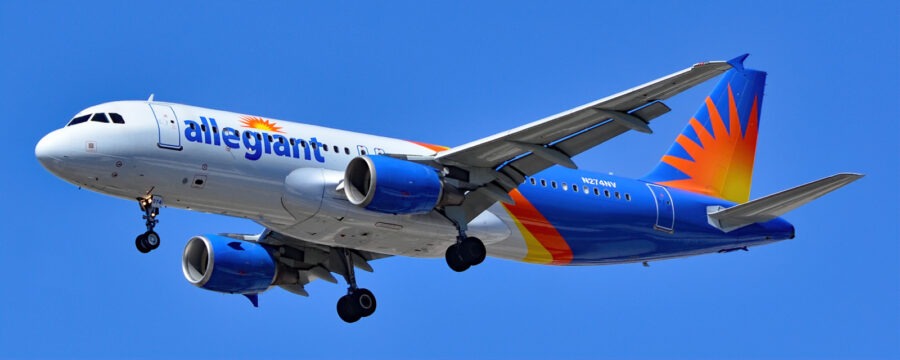 a large passenger jet flying through a blue sky