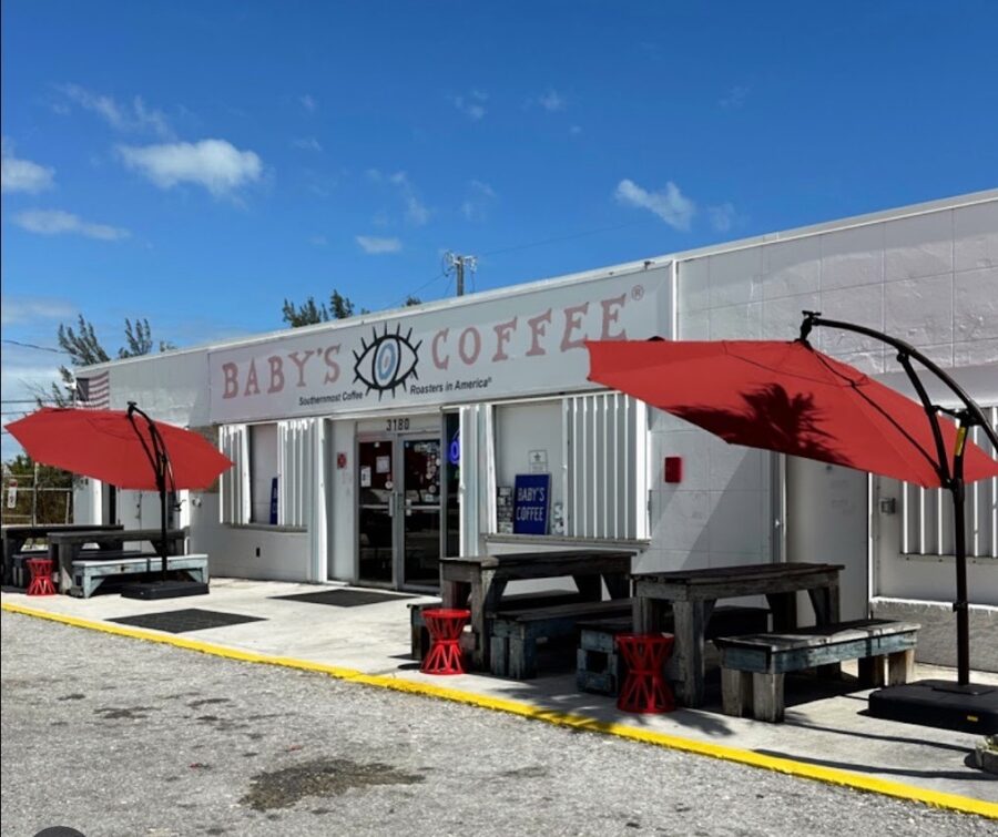 a building with red umbrellas outside of it