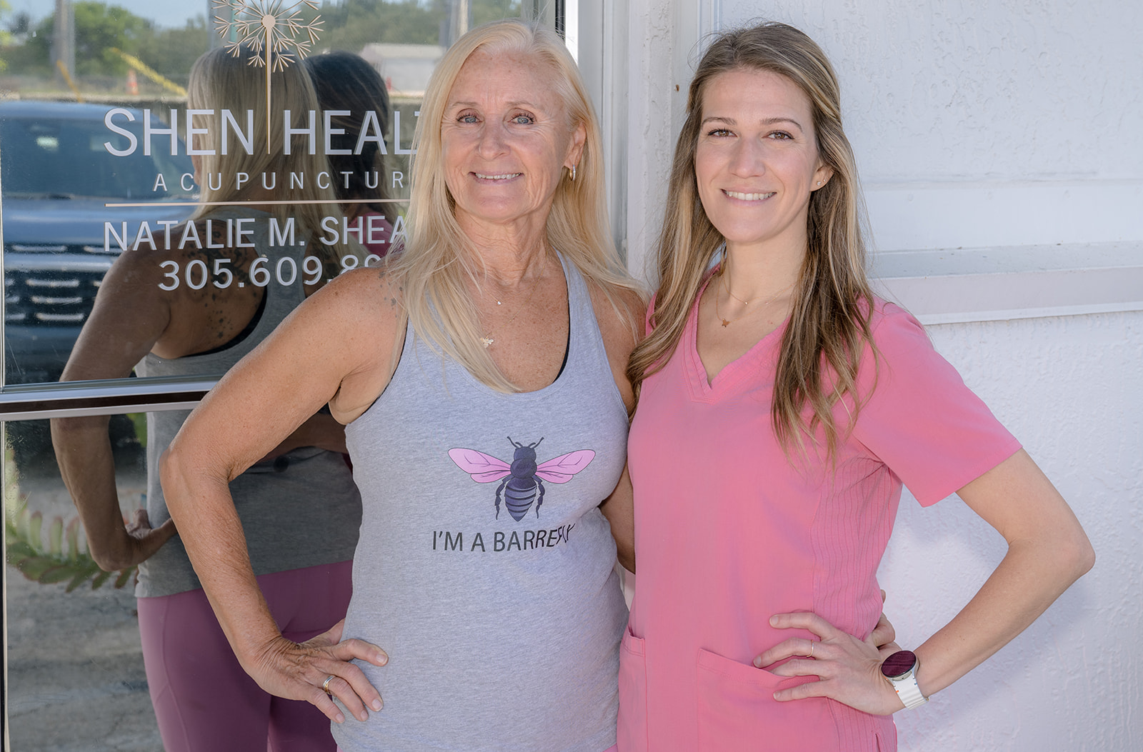 a couple of women standing next to each other