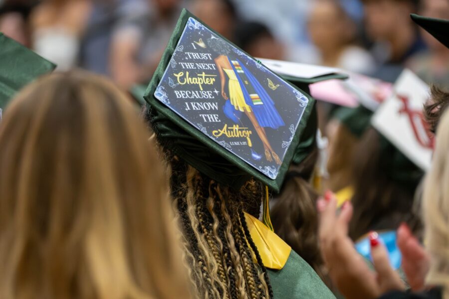 a group of people in graduation caps and gowns