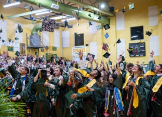 a large group of people in graduation gowns