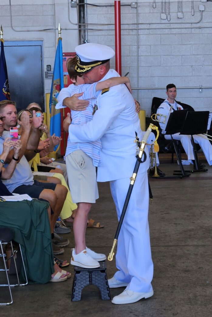 a couple of people that are hugging each other