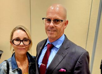 a man and a woman standing next to each other