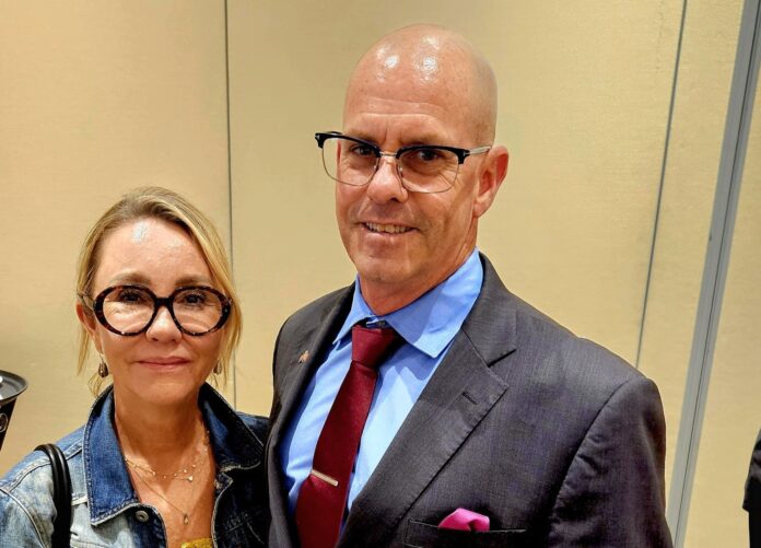 Ed and Lori Tierney in KW a man and a woman standing next to each other
