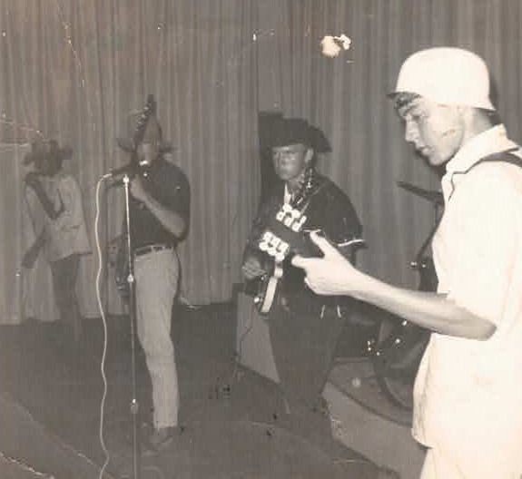 a group of men standing next to each other